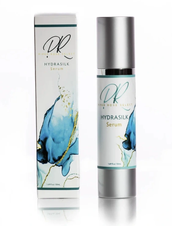 HydraSilk Repair Serum bottle on minimal backdrop