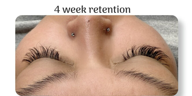 Close-up view of a client before an eyelash enhancement service, showing natural lashes with lighter density and shorter length prior to professional lash application and refinement.